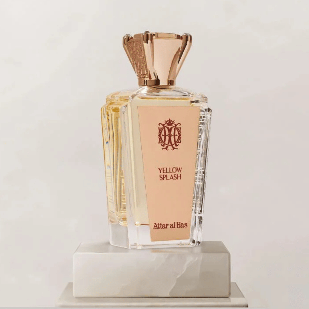 Perfume bottle labeled 'Yellow Splash' by Attar al Has on a light background