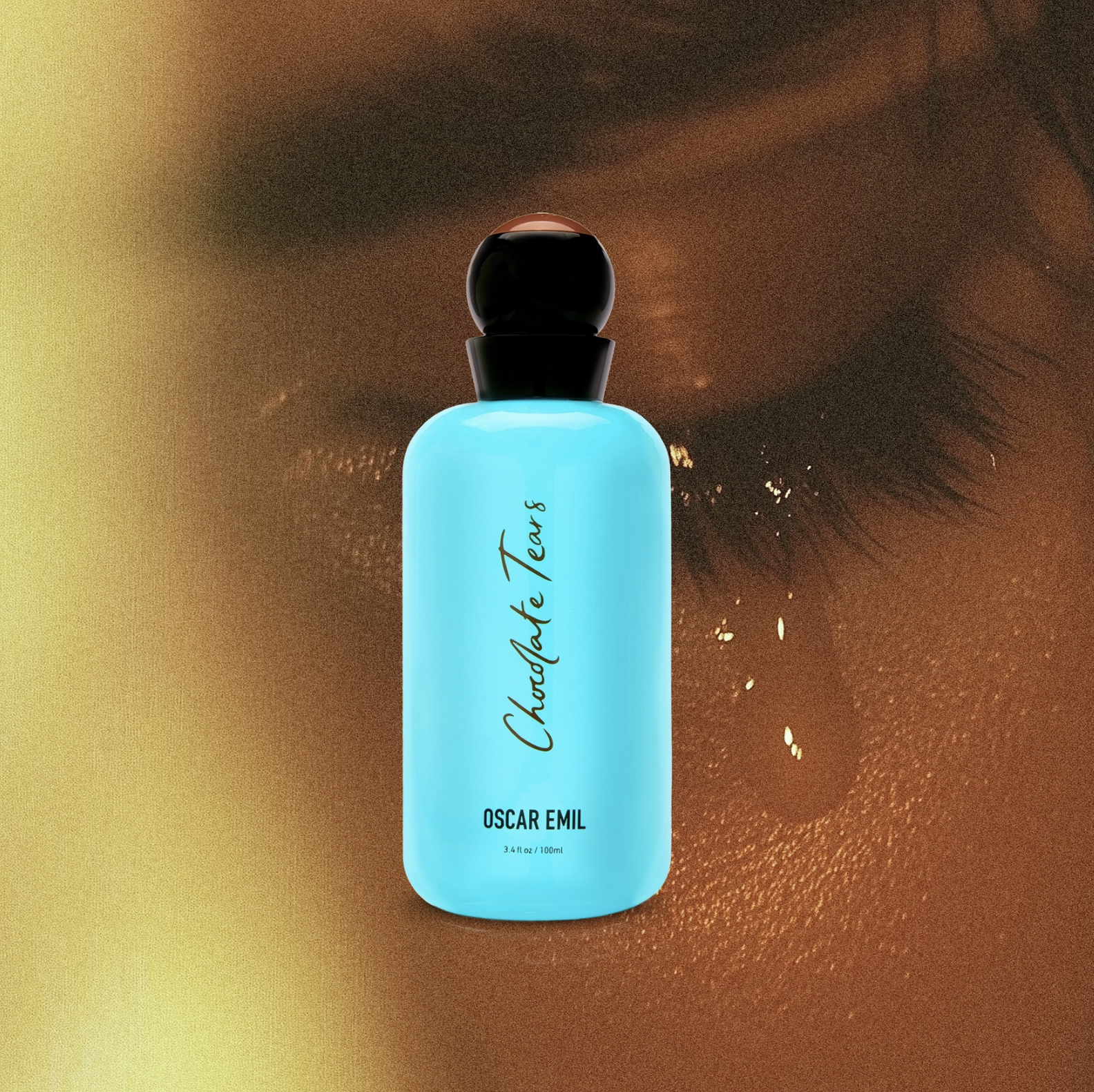 Blue bottle labeled 'Chocolate Tears' with a close-up of eyelashes on a textured brown background