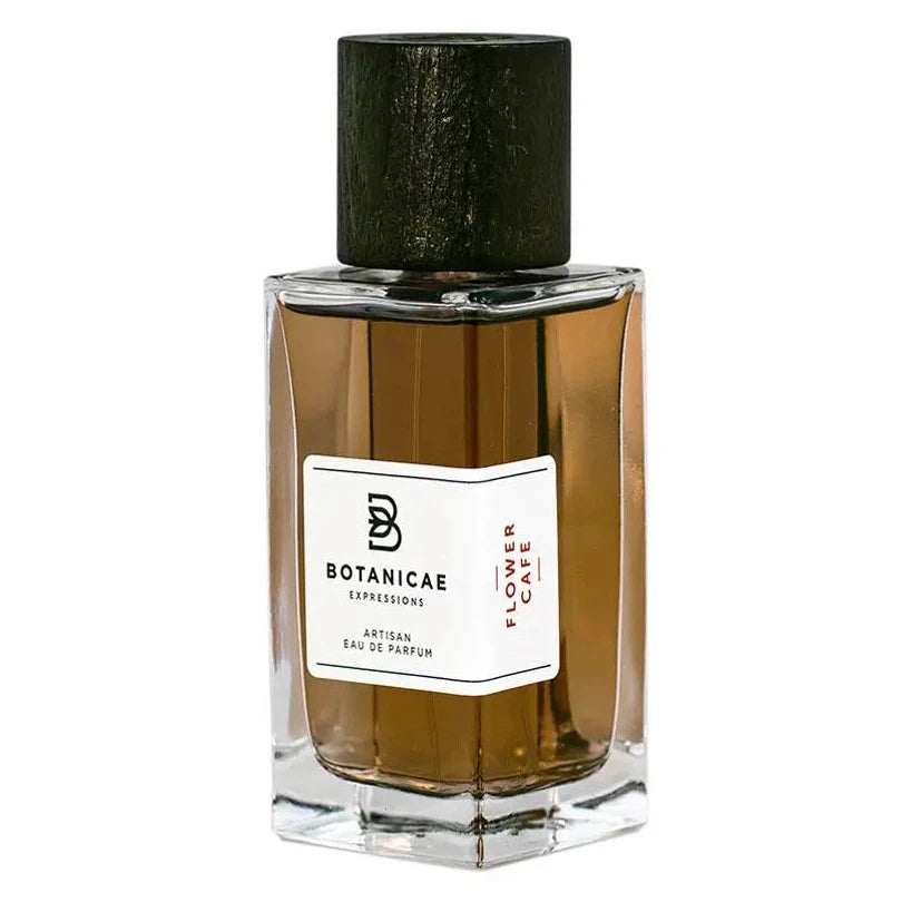 Perfume bottle with a black cap and clear glass body on a white background