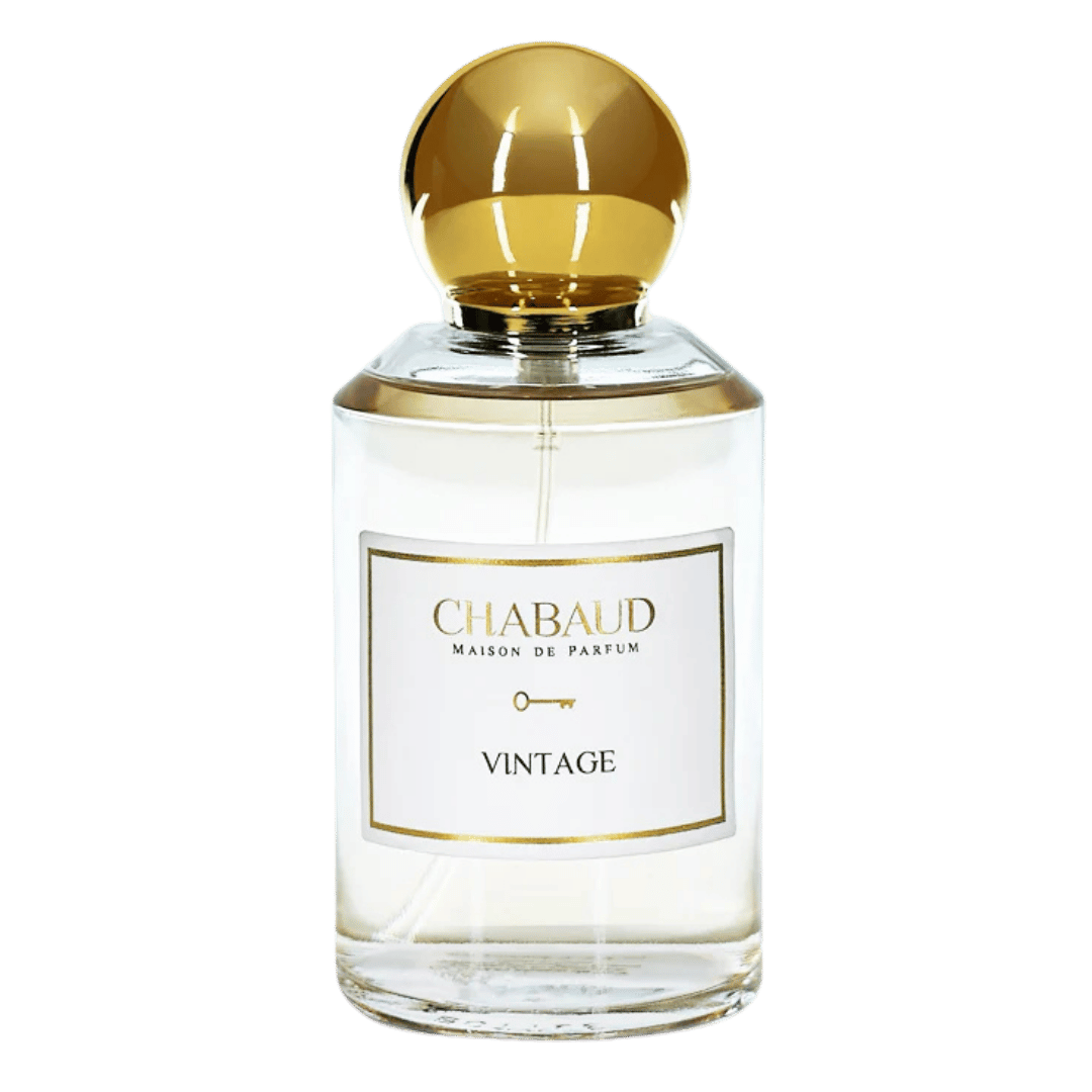 Chabaud Maison de Parfum Vintage perfume bottle with a round gold cap and a white label, shown against a solid green background.