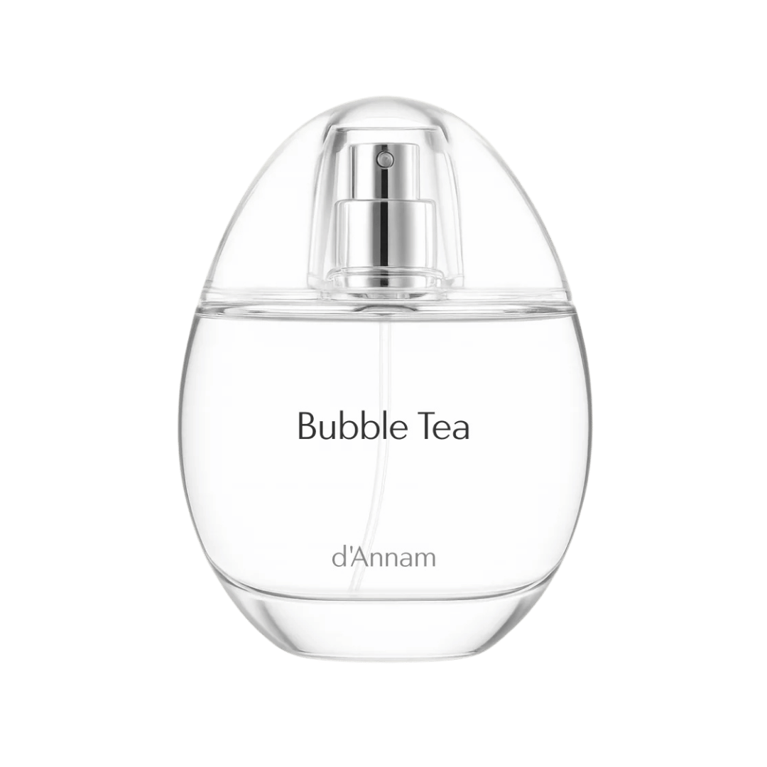 A clear egg-shaped perfume bottle labeled 'Bubble Tea' by d'Annam, featuring a transparent body, silver pump, and black text on a white background.