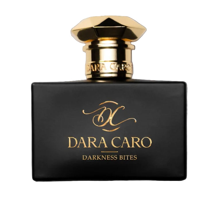 A black perfume bottle with a gold cap, labeled 'DARA CARO DARKNESS BITES'.