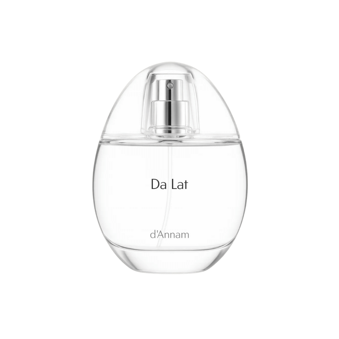 Clear perfume bottle labeled 'Da Lat d'Annam' on a light green background