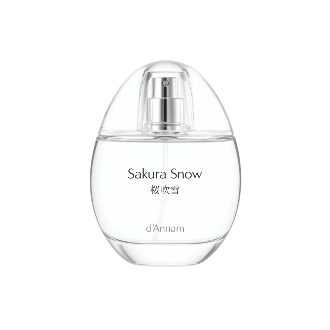 Sakura Snow perfume bottle by d'Annam on a green background