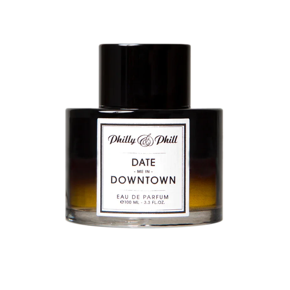 Perfume bottle labeled 'Date Me in Downtown' by Philly & Phill on a white background