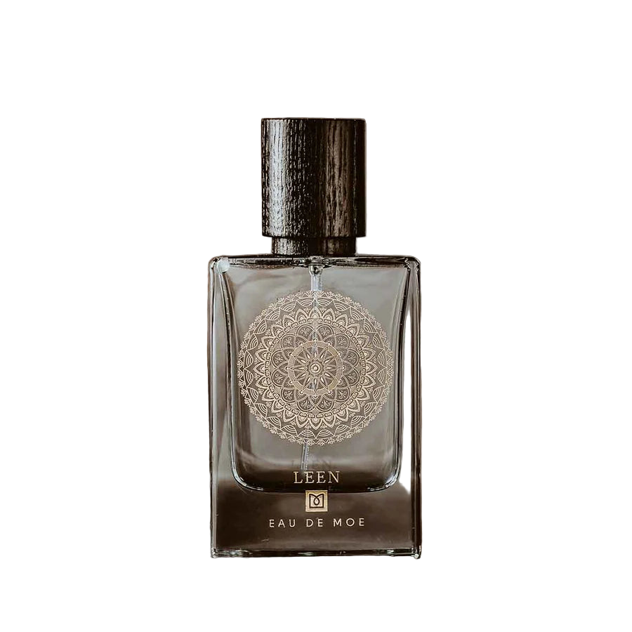 EAU DE MOE - LEEN EAU DE PARFUM 2.7 OZ FOR WOMEN Perfume bottle with decorative label on a white background