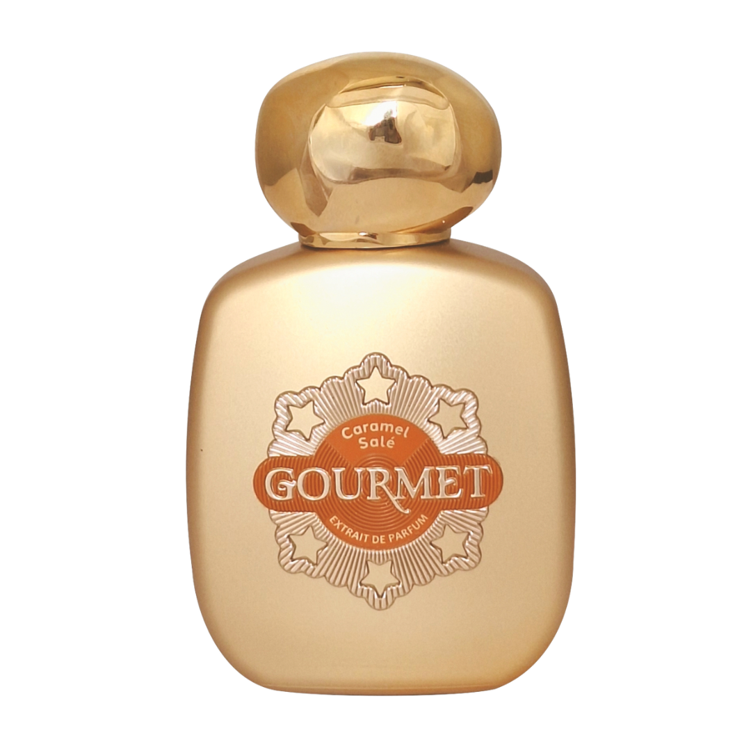 Gold perfume bottle with 'Gourmet' label on a white background