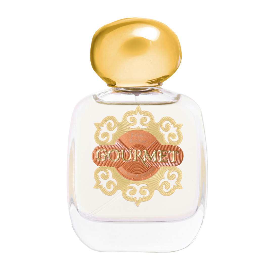 Perfume bottle with gold cap and decorative label on a white background