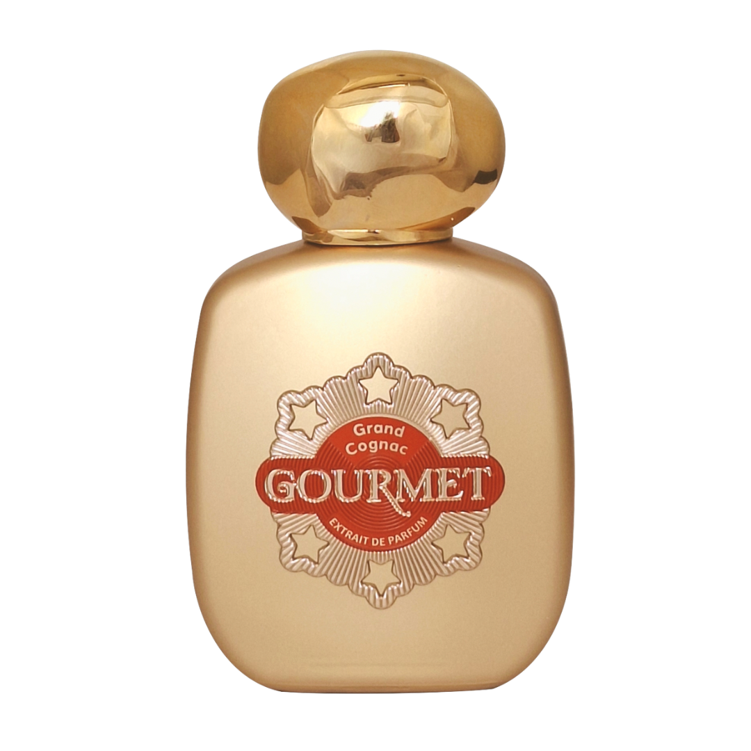 Gold perfume bottle with 'Gourmet' label on a white background