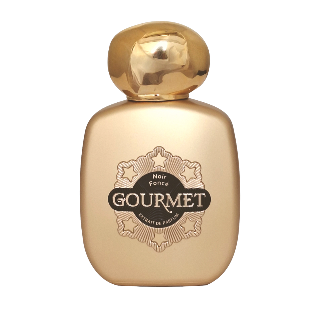 Gold perfume bottle with 'Gourmet' branding on a white background