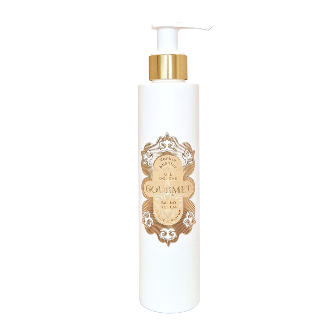 White bottle with gold pump and decorative label on a white background