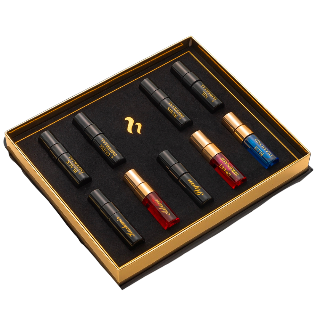Set of small bottles with gold and black packaging in a box