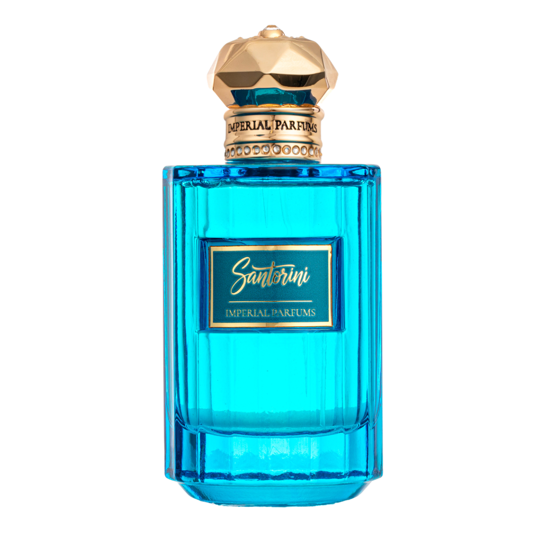 Blue perfume bottle with gold cap on a white background