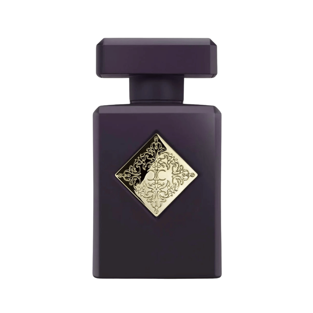 Purple perfume bottle with gold decorative label on a white background