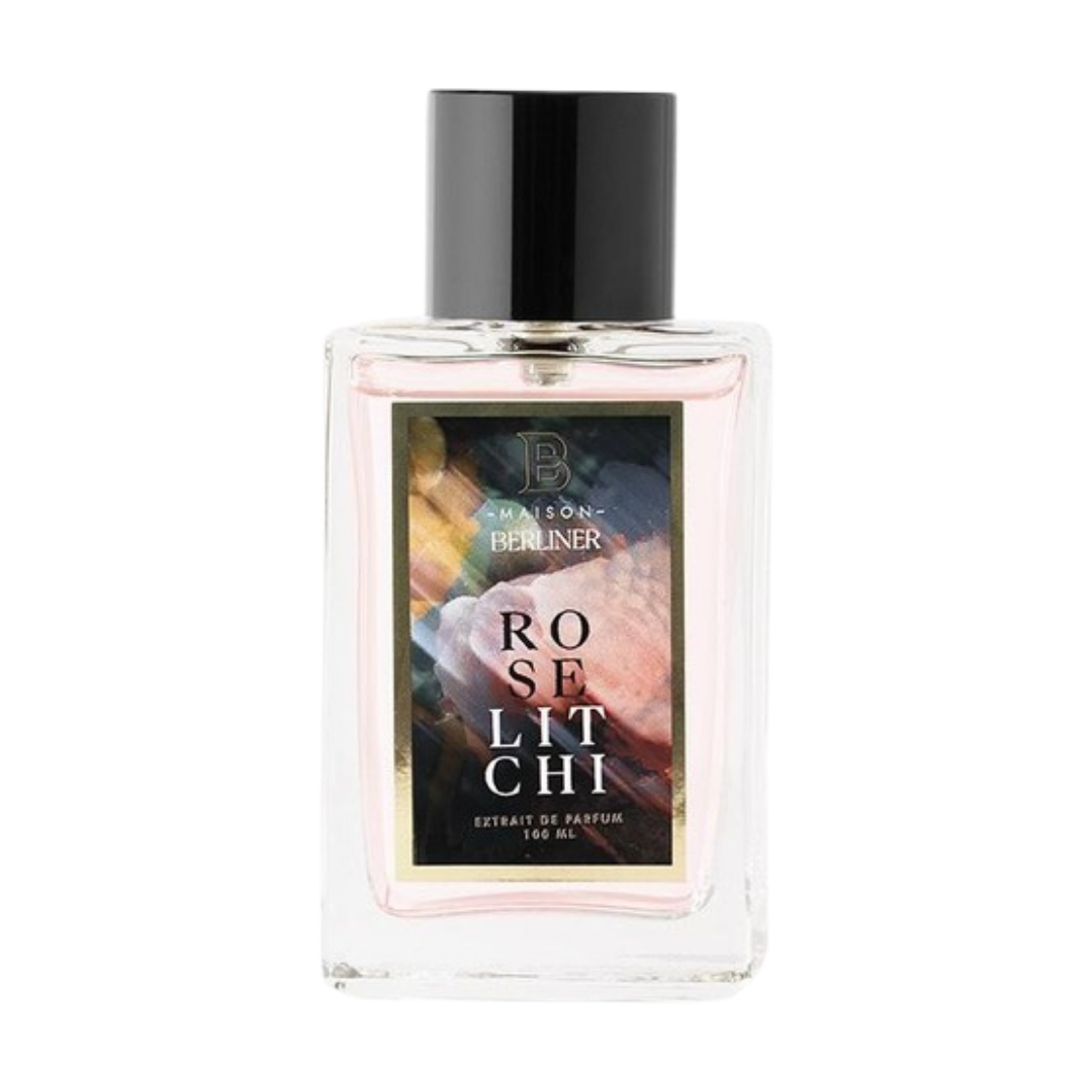 A clear glass perfume bottle with a black cap and a colorful label reading 'ROSE LITCHI' and 'Maison BERLINER', shown on a plain white background.