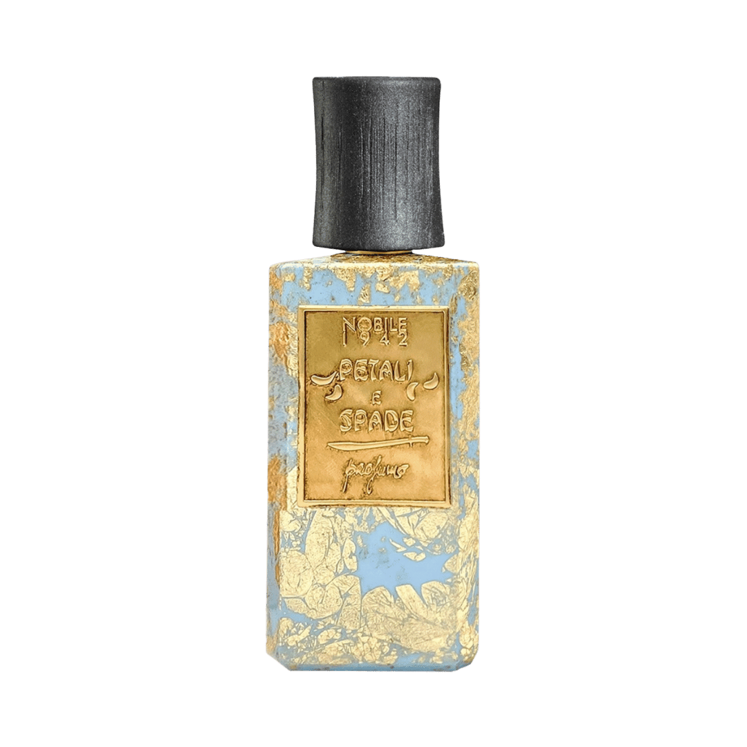 Perfume bottle with gold label on a green background