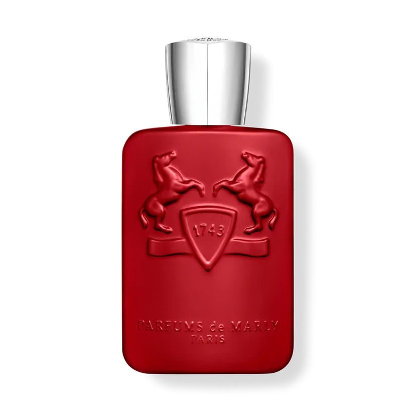 Red perfume bottle with silver cap on a white background