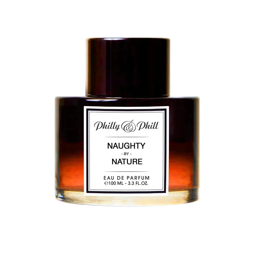 A bottle of Philly & Phill Naughty by Nature Eau de Parfum with a dark tinted liquid and a label that reads 'NAUGHTY NATURE EAU DE PARFUM 3.4 OZ'.