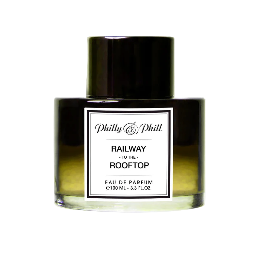 Perfume bottle labeled 'Railway to the Rooftop' by Philly & Phill on a white background