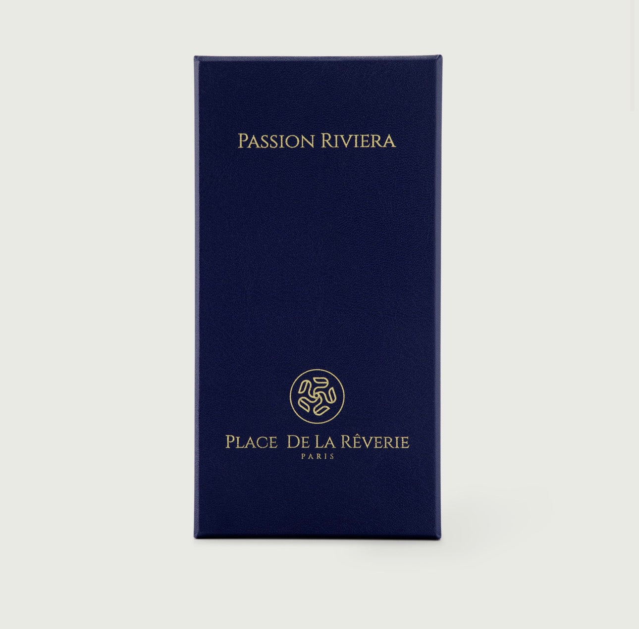 Navy blue box with 'Passion Riviera' and 'Place De La Réverie' branding on a light gray background