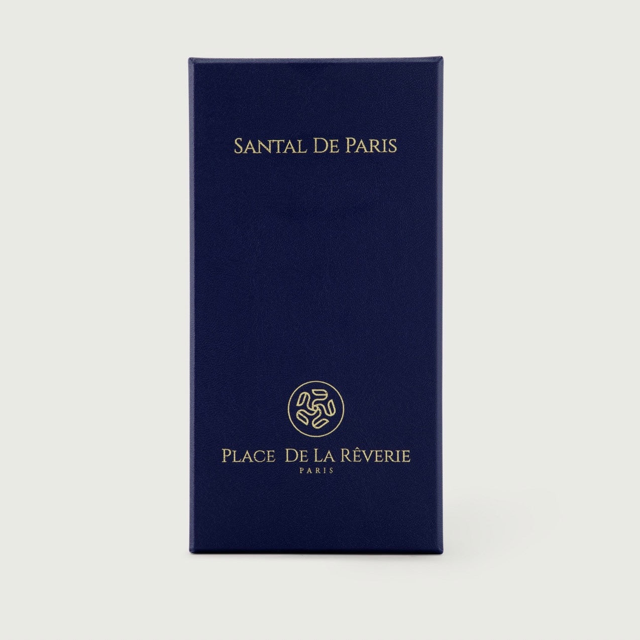 Navy blue packaging with 'Santal De Paris' and 'Place De La Reverie' branding on a light gray background