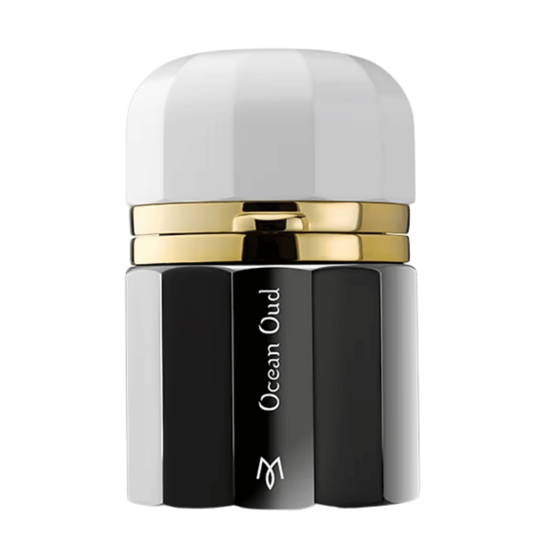 A luxury cosmetic bottle with a glossy black and white faceted design, featuring a polished gold metallic band around the neck. The bottle is labeled 'Ocean Oud' with a stylized 'M' logo at the bottom, set against a clean white background.