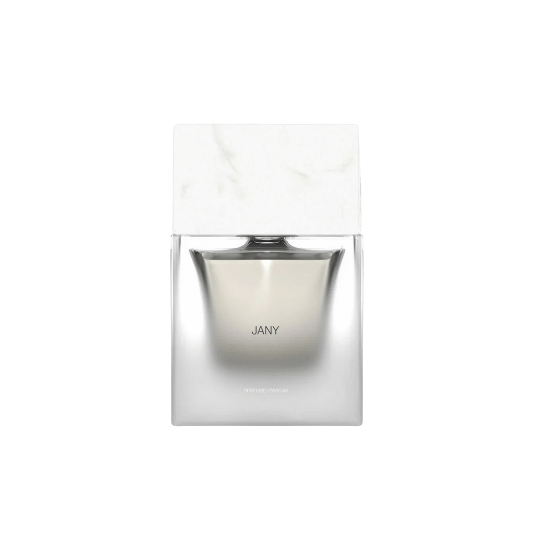 Silver perfume bottle with 'JANY' branding on a white marble background