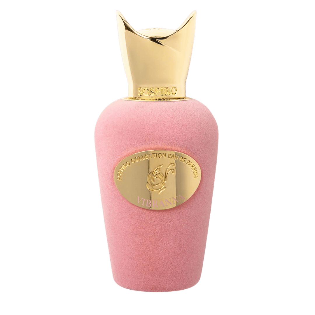 Pink perfume bottle with a textured pink body, a gold metallic oval label, and a gold metallic cap, shown on a plain white background.