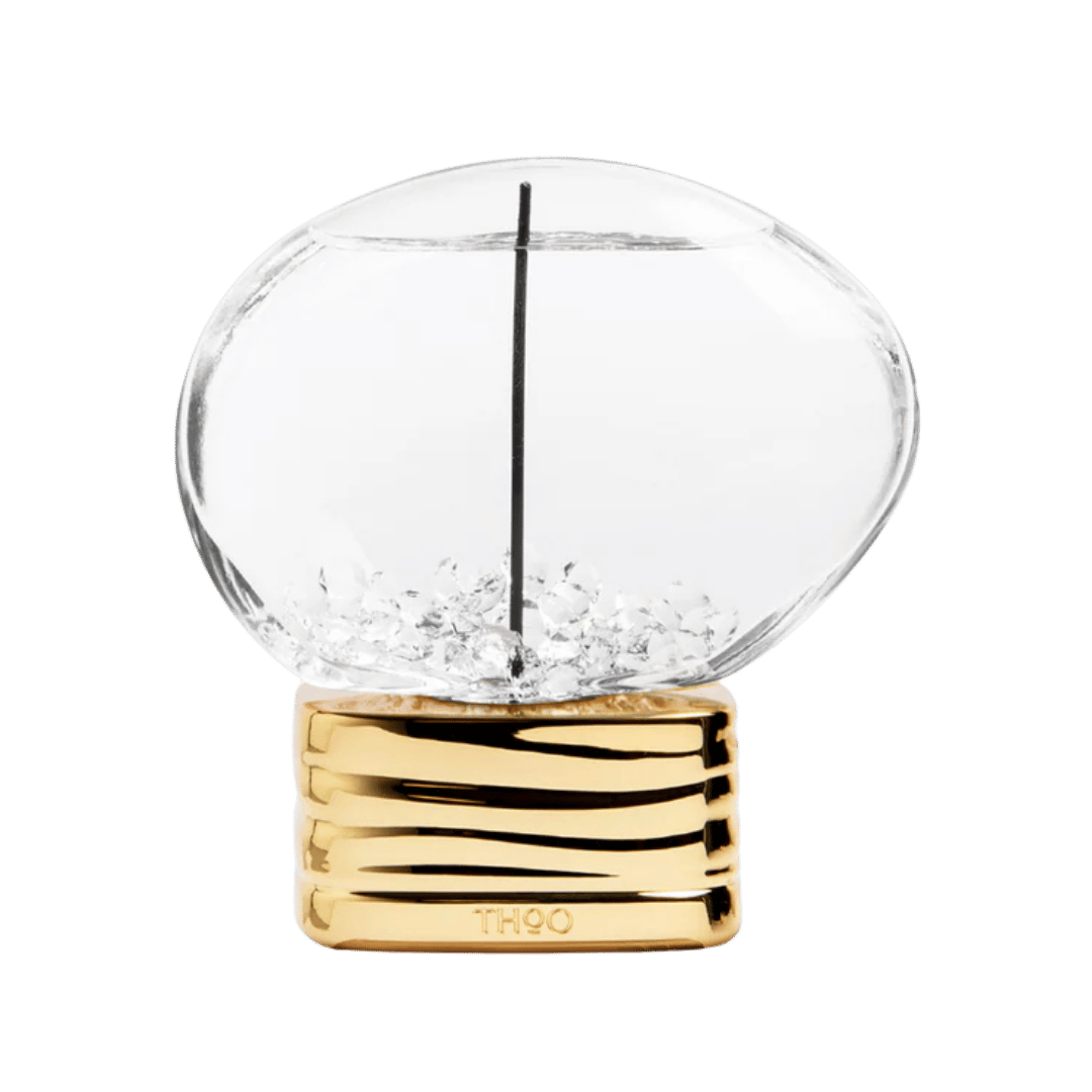Clear glass sphere with gold base on a white background